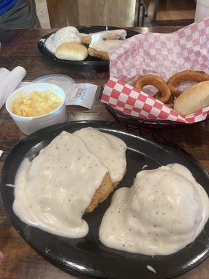 Chicken fried steak, onion rings, and mac