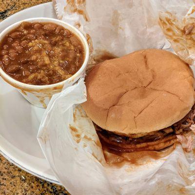 Large, BBQ pork sandwich and baked beans