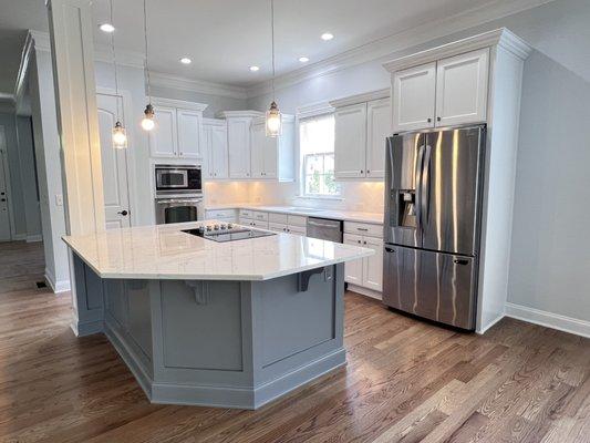 Kitchen makeover, painted existing cabinets, installed counter tops, refinished hardwoods, installed backsplash