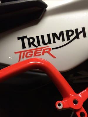 Powder coating to match the orange lettering in the gas tank.