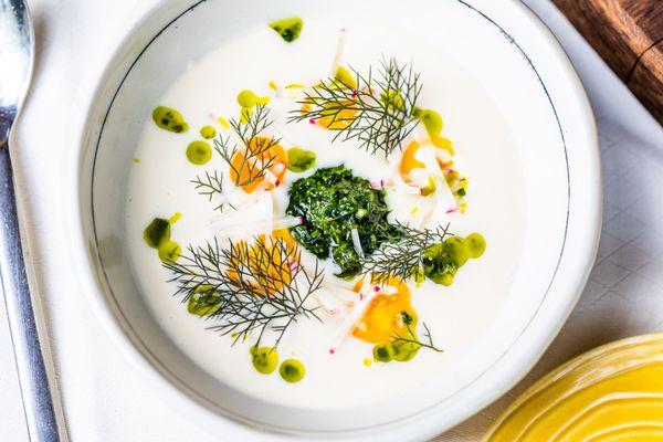 Cauliflower Soup with farm radish, chive blossom, buttermilk, herb pistou