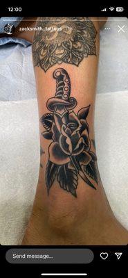 Dagger through rose tattoo