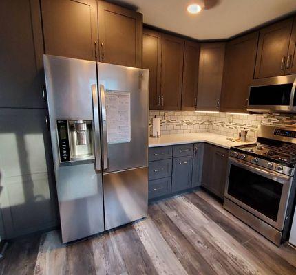 Love our corner cabinet, pullout garbage bin and pullout spice rack.