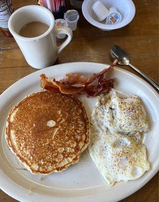 Pancake breakfast with over medium eggs and bacon- all perfectly cooked and delicious!