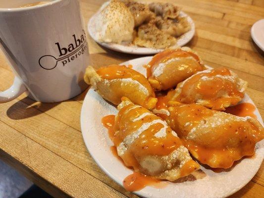 Guava pierogies and blueberry pierogies with a mug of coffee