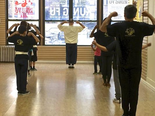 Here's our kids class, practicing forms together.