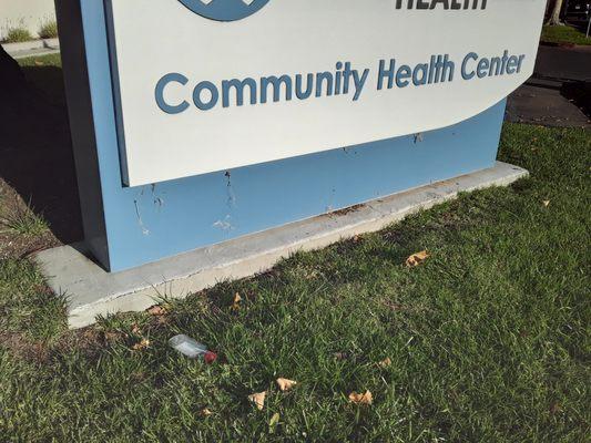 vodka bottle in front of sign