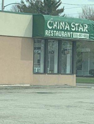 China Star has kids outside with food tongs picking up trash