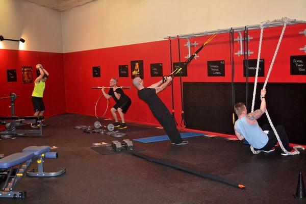 Employee after hours workout at Fitness Gear & Training in our revolutionary 30-Minute Fit group training area - Just the boy...