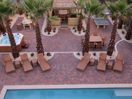 Paver pool deck, and palm tree installation.