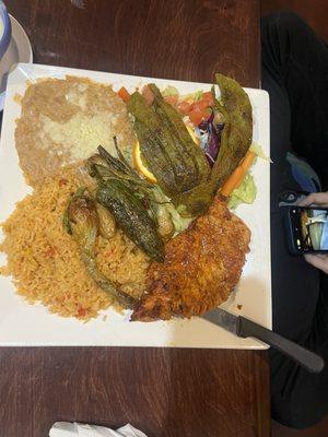 Pollo Azteca- Boneless chicken breast grilled with nopal (cactus) and Mexican onion. Served with rice, beans, and tortillas.