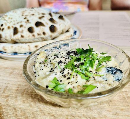 Pita in the background with the charred eggplant.