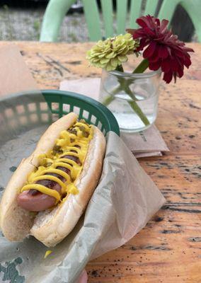 Hot dog with mustard and relish