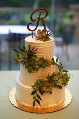 Such a beautiful cake with succulents to match my bouquet and my husband's boutonniere.