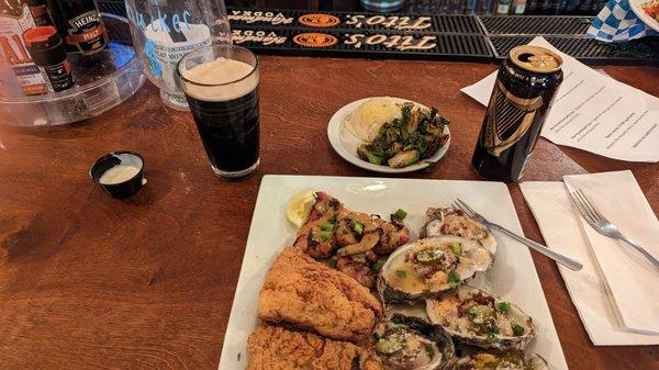 Chargrillled oysters ,grouper, shrimp.pompano, brussel sprouts and mashed potatoes with a can of Guinness nitro