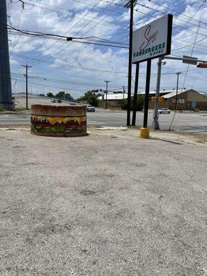 Burger sign in parking lot area at corner of Irving Blvd & Wycliff