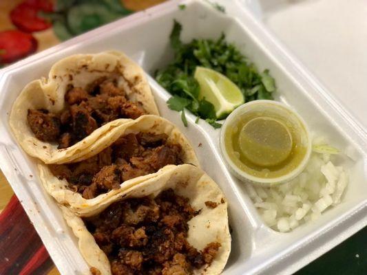 Chorizo and al pastor tacos.