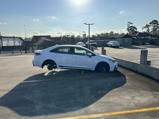 Car on bricks with tires stolen due to lack of security