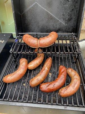 Fresh made sausages on the smoker