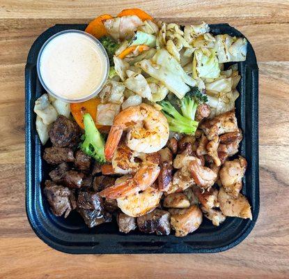 Meat Party Hibachi (Steak, Chicken & Shrimp) with Vegetables and Teriyaki Sauce/Yum Yum Sauce.