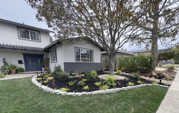 Lovely tumbled bluestone edger for a full front yard softscape remodel.