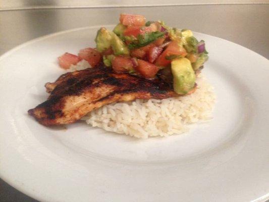 Chef Carl's blackened Tilapia over rice with a tomato avocado salsa $7.50