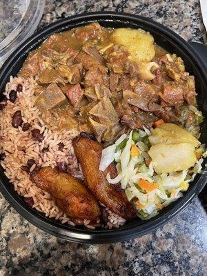 Curry goat with rice and beans