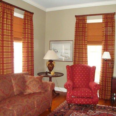 Plaid drapes with roman shades on 2" wood rods