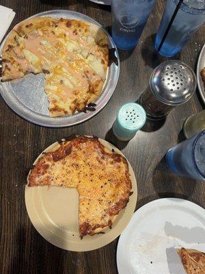 Cheese pizza and buffalo chicken pizza