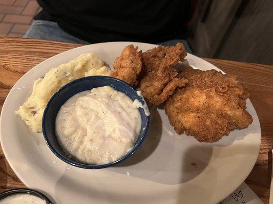 Chicken Fried Chicken with Gravy on the side, and Mashed Potatoes