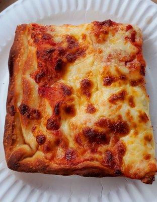 Very good Sicilian slice. Nice and crispy, good sauce and well done cheese.