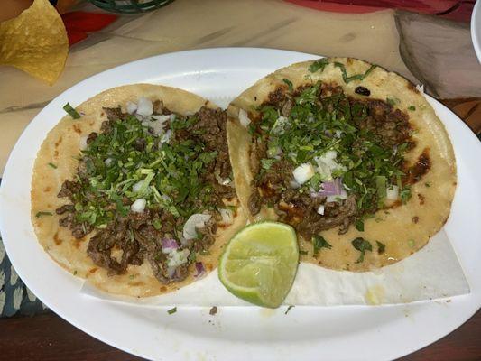 Cilantro and onion steak tacos with lightly fried tortillas!!!! The best in town!