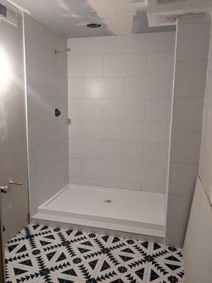 Shower tile and flooring tile, pre-painting and finish plumbing,.