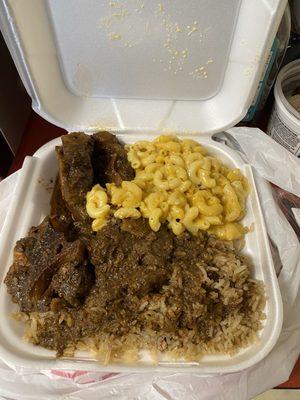 Oxtail and Side Baked Mac n Cheese and Rice and Peas