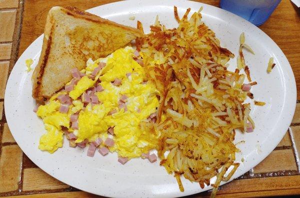 Ham and eggs with hash browns and toast