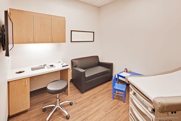 Exam rooms with flat screen TV, couch and Wi-Fi.