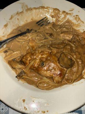 Dry, Unseasoned Chicken Marsala with Soddy noodles and what looks and tastes like gravy.