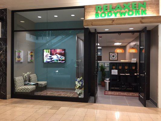 In woodlands mall ( first floor near by Dillard's, next door of nail store ) www.Relaxenbodywork.com