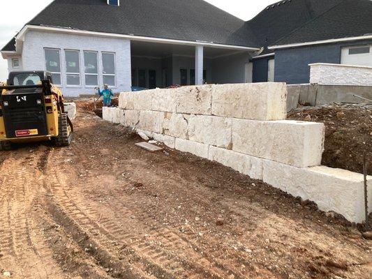 Limestone butterstick block wall going in!