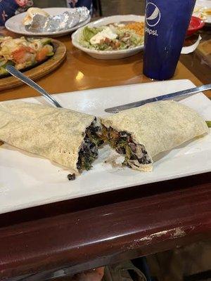 Veggie burrito. I asked for black beans and grilled peppers. Very Good.   Asked for no queso but forgot to say no Cheese so some instide.