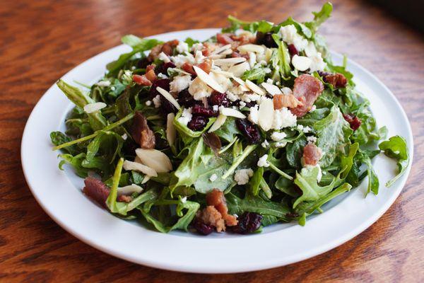 Osborne House Salad: Mixed greens tossed in our house lemon vinaigrette with cherry tomatoes, red onion, and finished with a balsamic glaze.