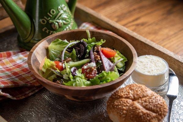 House Salad- Romaine Hearts, Mixed Greens, Cherry Tomatoes, Cucumber, Red Onion, Shaved Carrots, Walnuts Pieces and Champagne Vinaigrette