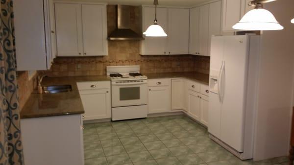 Kitchen 2 weeks later . The only thing original was the tile floor.  Everything else was built on site cabinets and doors