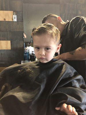 Erin cutting my sons hair