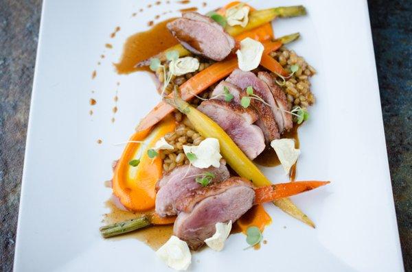 duck 8 oz. duck breast, malt glazed barley, glazed baby carrot, carrot puree, crispy parsnip, honey jus, micro greens.