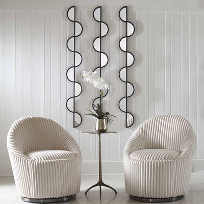 UttermostW Set of three iron wall pieces showcase a curved silhouette finished in matte black with inset mirrored accents.