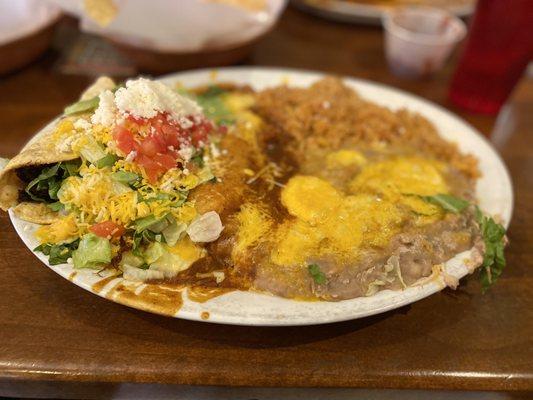 Shredded beef taco and chicken enchilada combo plate