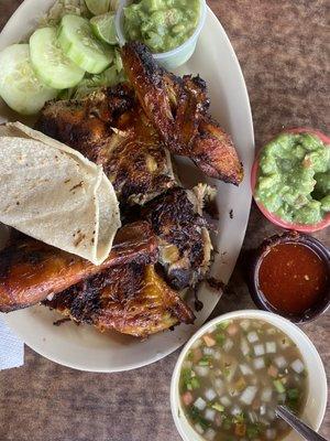 The half chicken plate. Comes with tortillas, Peruvian bean style soup, guac, limes, salsa , cucumbers slices, and lettuce.