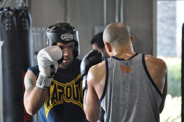 Robert Drysdale sparring with his coach Shawn Yarborough.