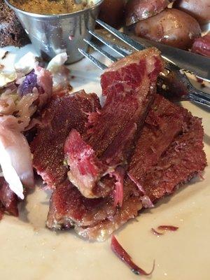 Dry corned beef with butter on top.